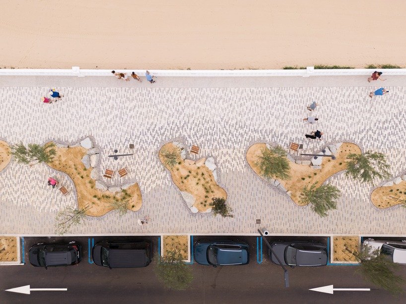 Sand, planting and paved surfaces within the Comillas waterfront landscape