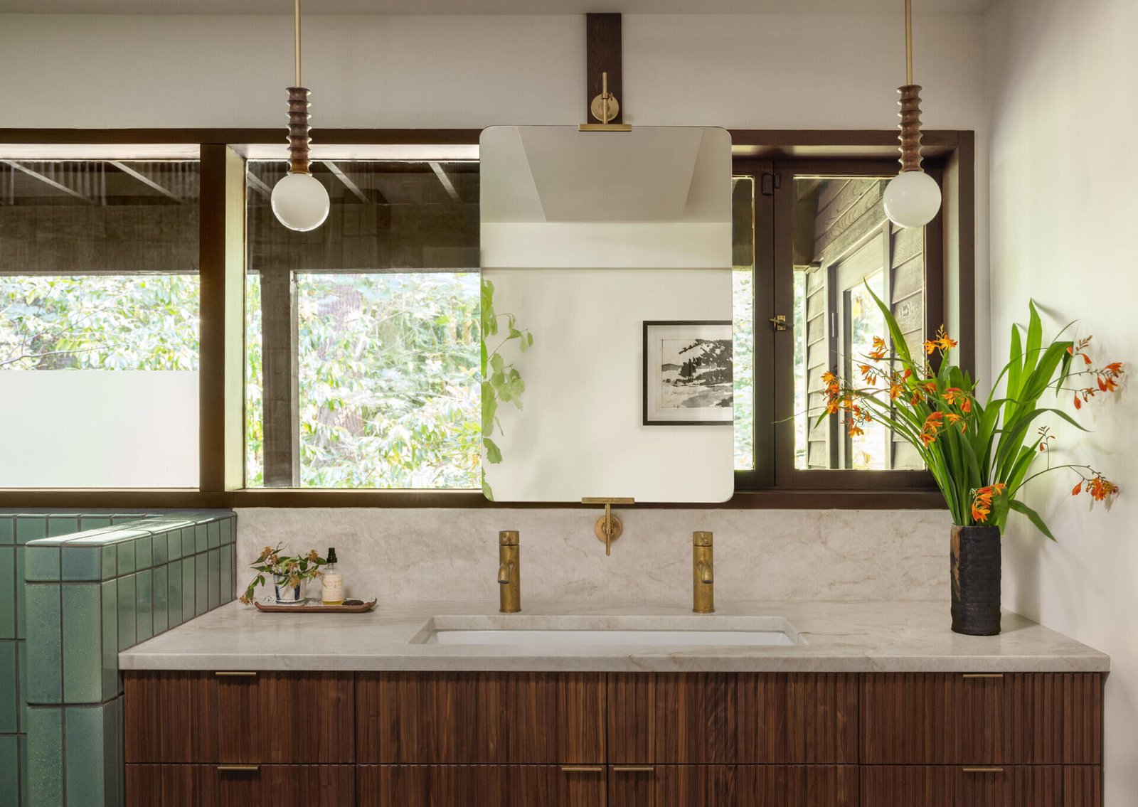 The double vanity continues the walnut material palette