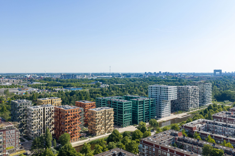 Westerpark West apartment buildings beside the water and green spaces in Amsterdam