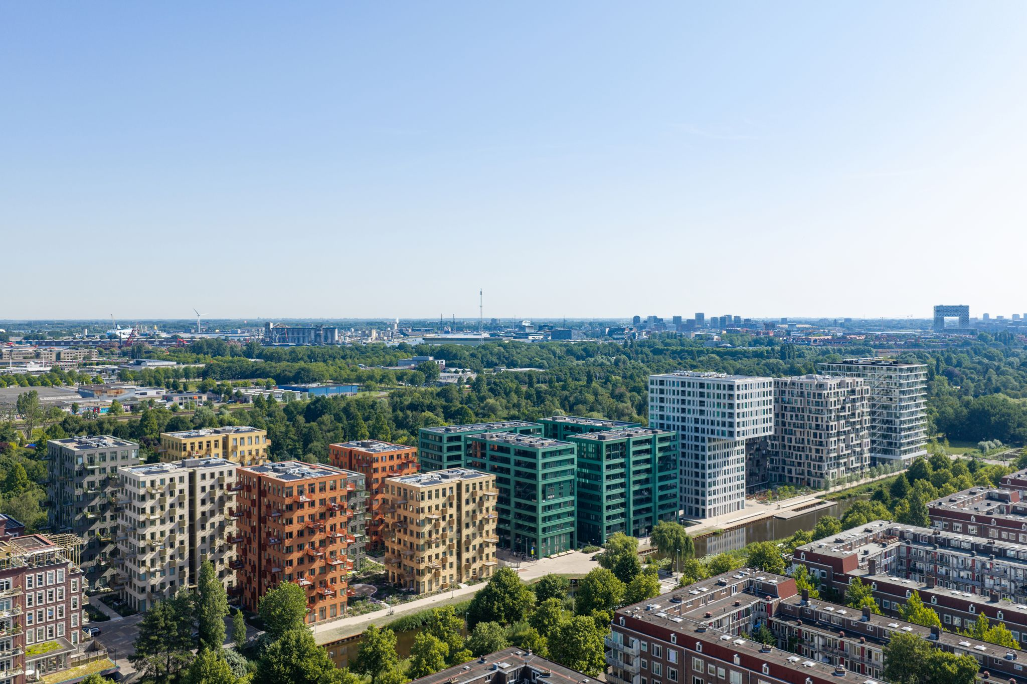 Westerpark West apartment buildings beside the water and green spaces in Amsterdam