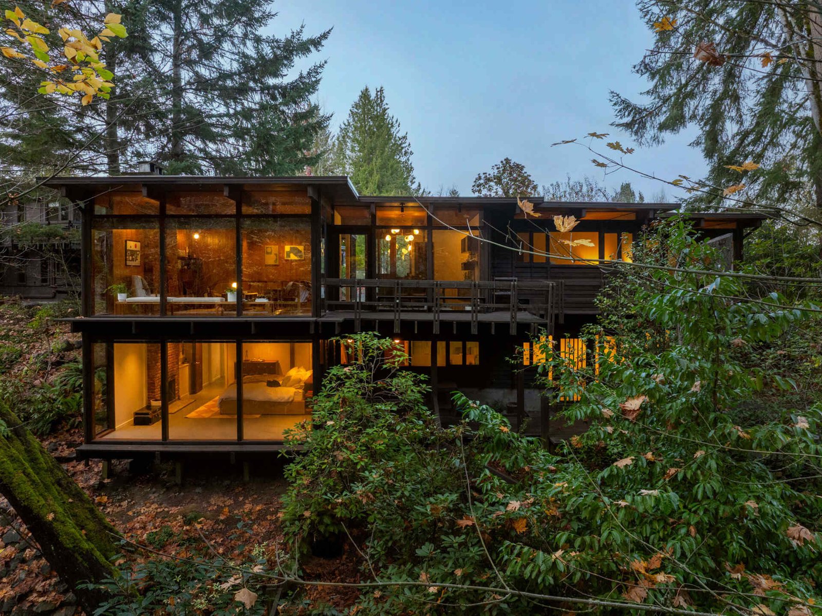 Two occupied levels open toward the wooded ravine