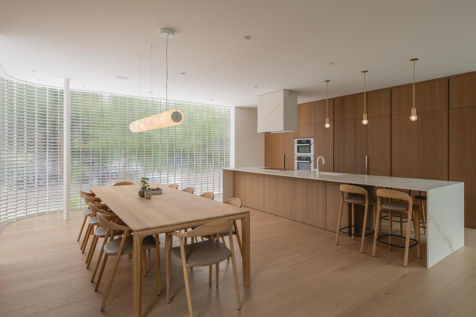 Dining and cooking share one open floor while keeping separate work surfaces.