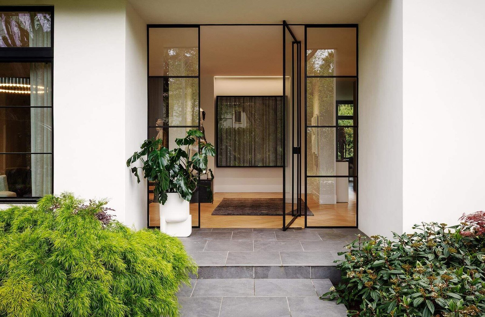 A glazed entrance makes an artwork visible before crossing the threshold.