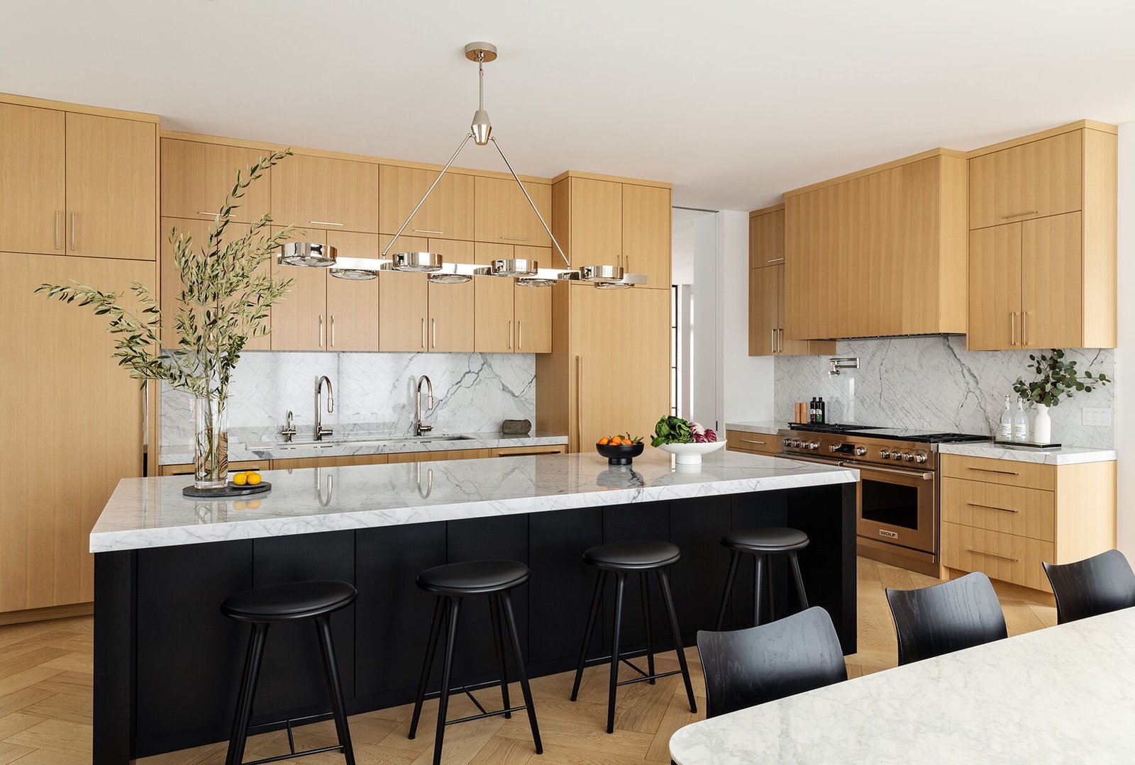 An everyday dining area occupies the window edge beside the kitchen.