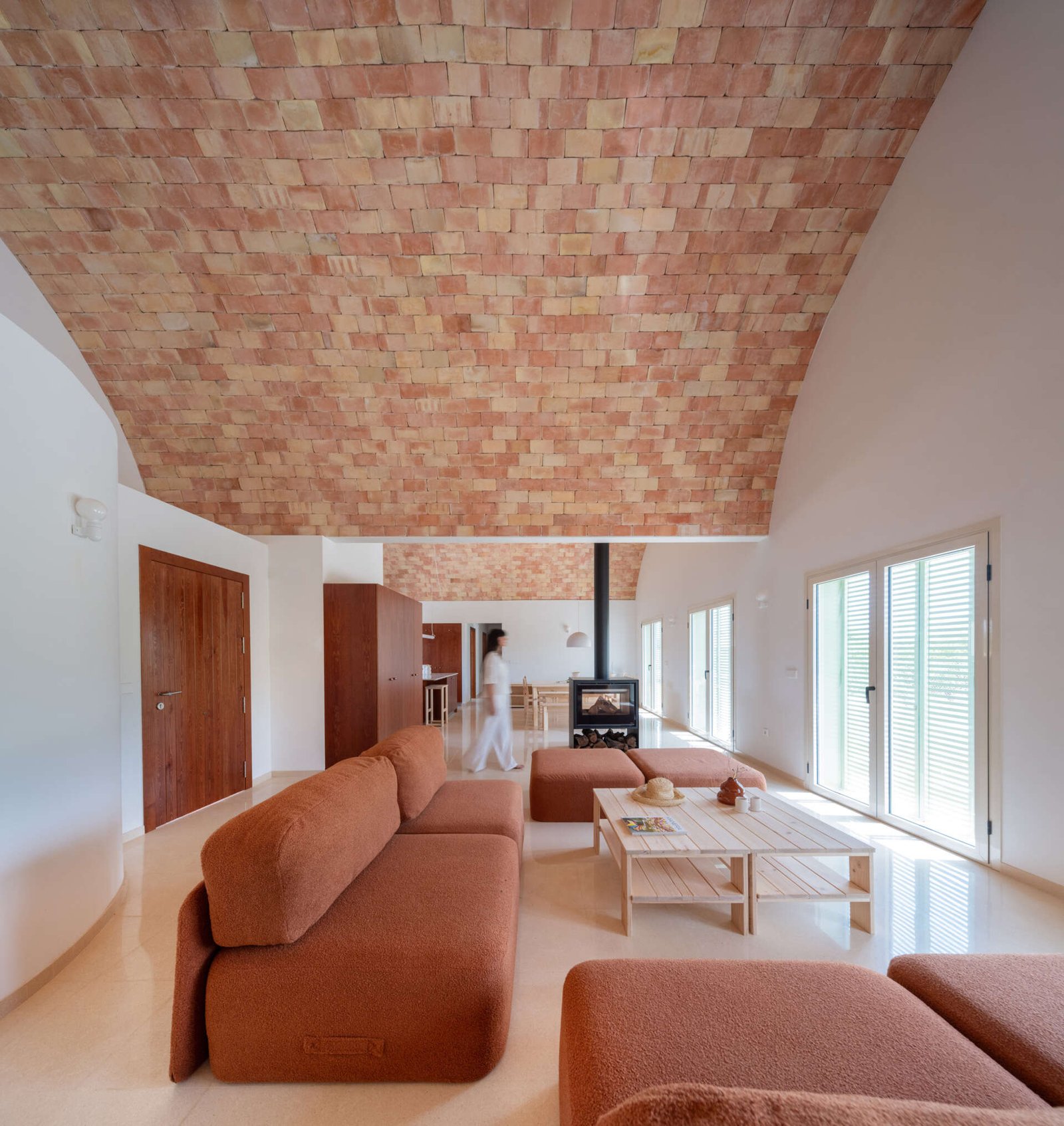Glazed doors bring the terrace into the living room’s field of view.