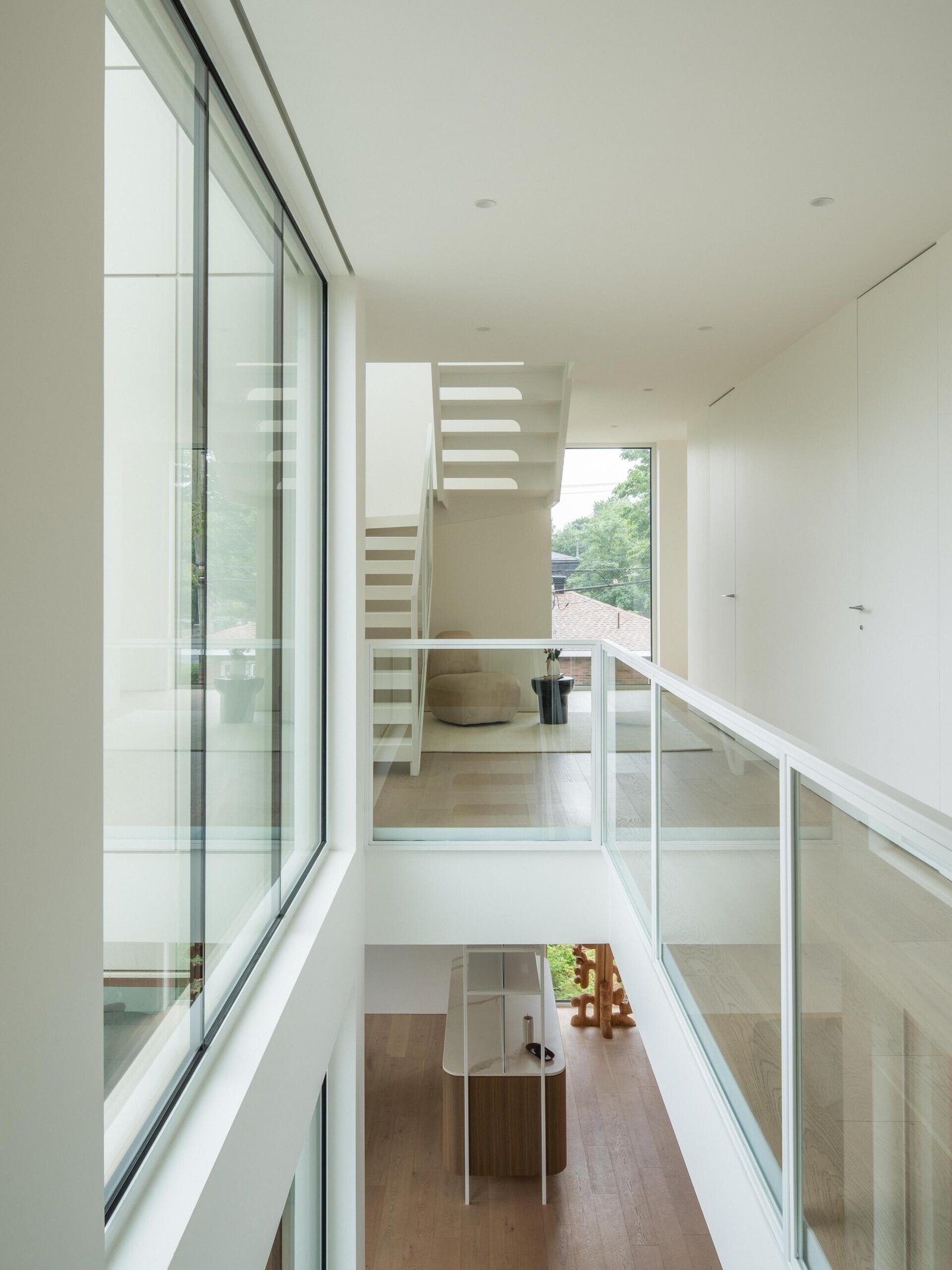 An upper walkway overlooks the vertically connected interior.