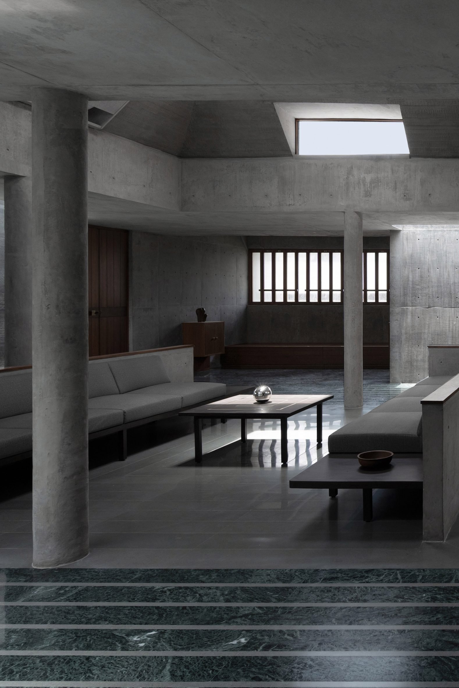 Central sitting room beneath the pyramidal roof and high skylight at Monastic Field