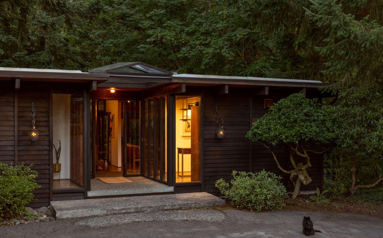 The recessed entrance beneath the existing roof