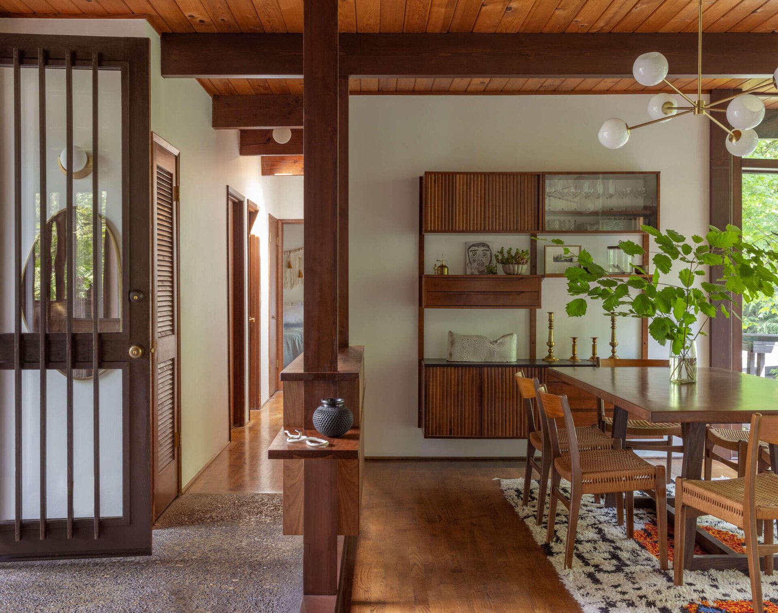 Dining furniture and storage establish a distinct place within the connected interior