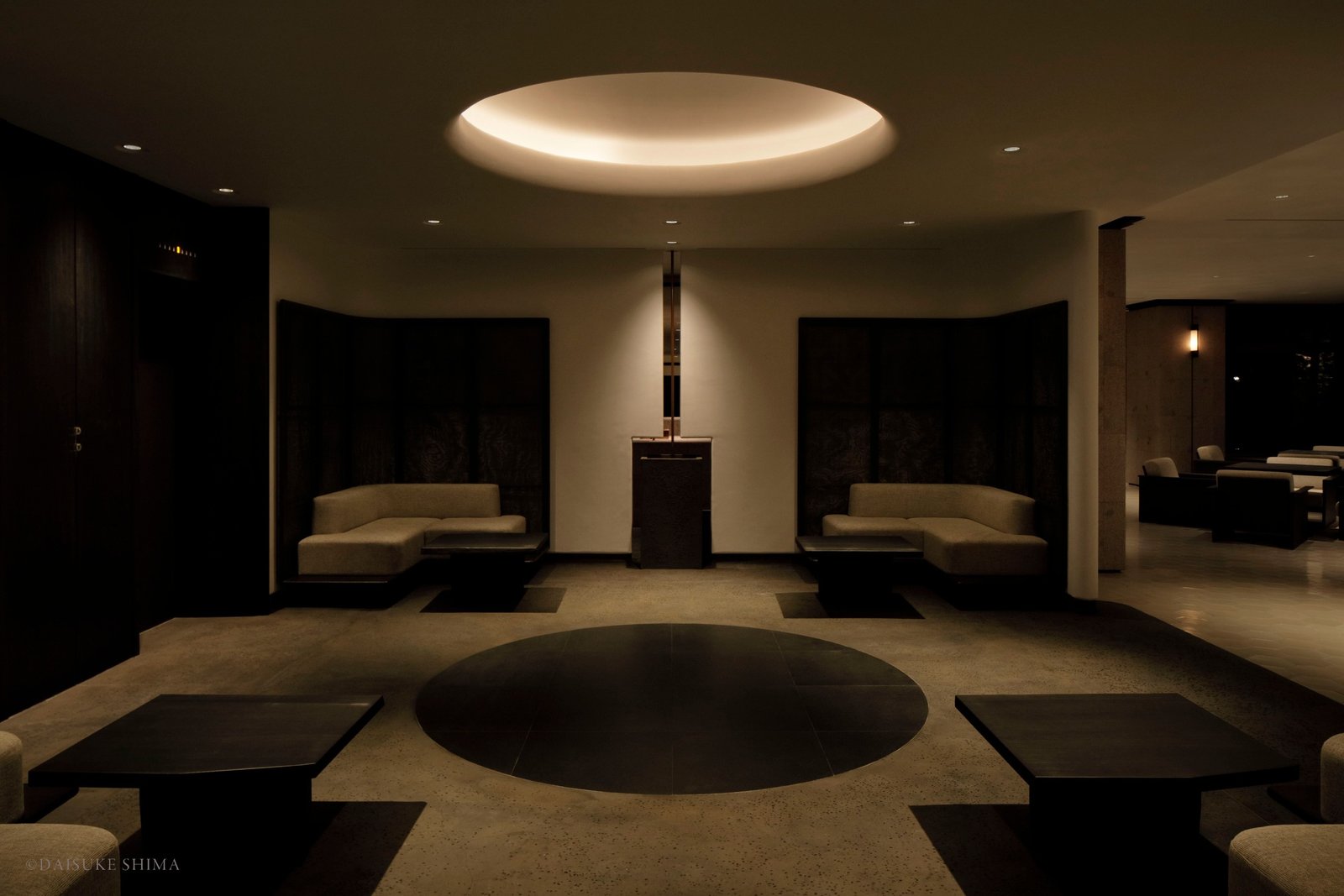 A garden approach, divided noren curtain and stone genkan build a measured arrival.